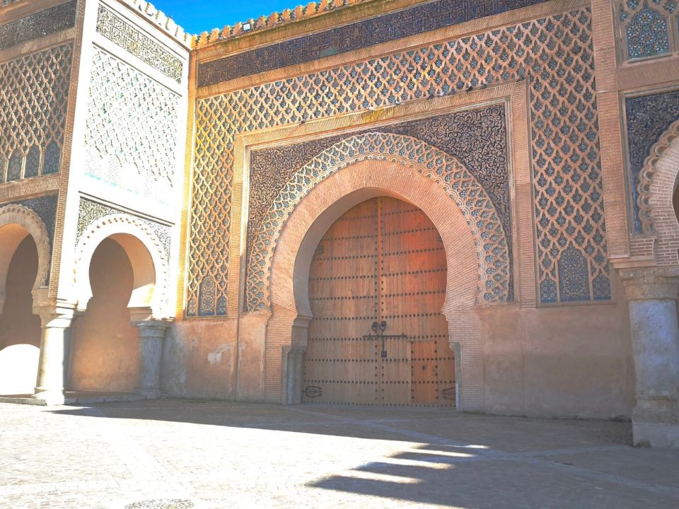 Traditional decorated gate and arched doorway in Meknes, Morocco