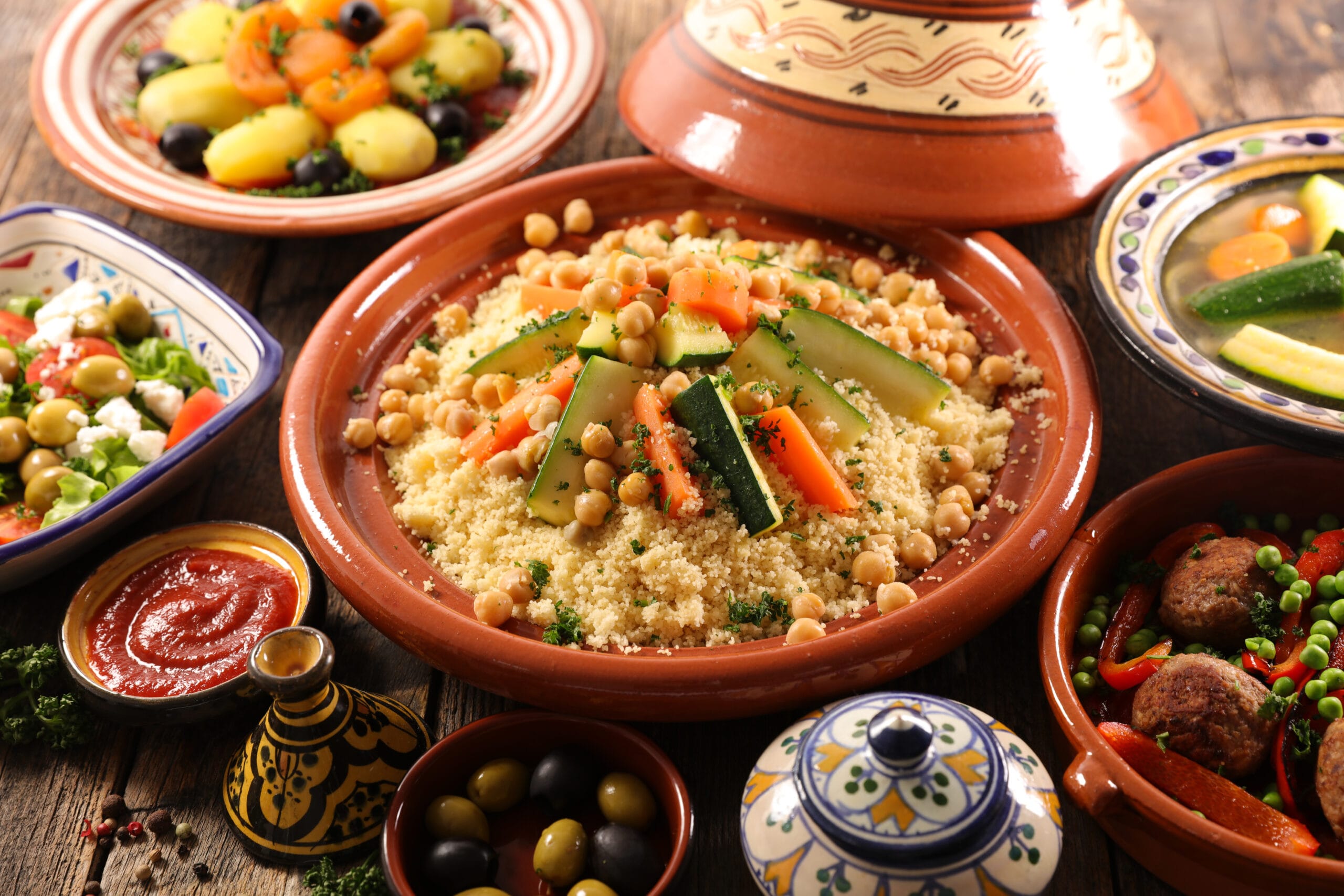Traditional Moroccan dishes including couscous and tagine during a local cultural food experience