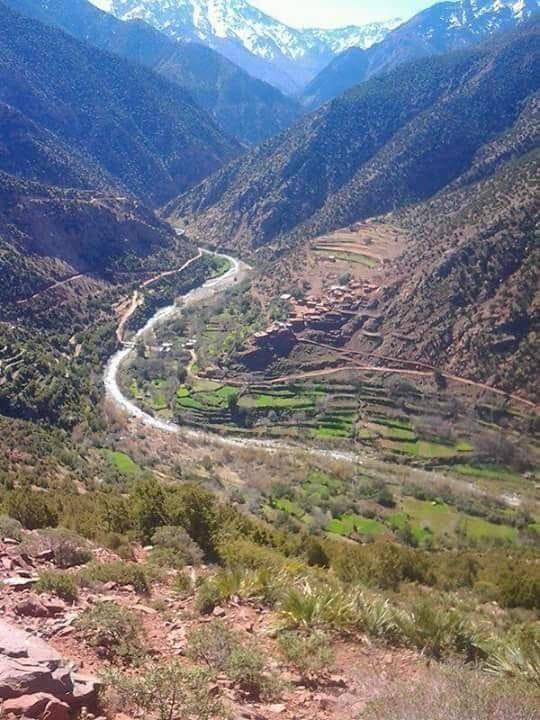 Wide view of the Atlas Mountains and valley in Morocco.