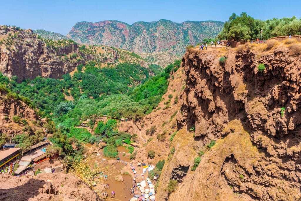 A scenic view of Ouzoud Waterfalls with visitors enjoying one of Morocco’s most famous natural attractions.