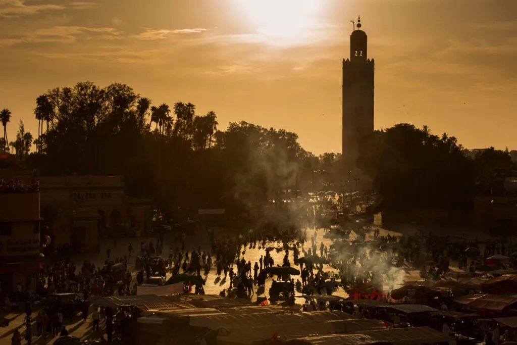 Lively Jemaa el-Fna Square in Marrakech with local culture, food stalls, and historic atmosphere