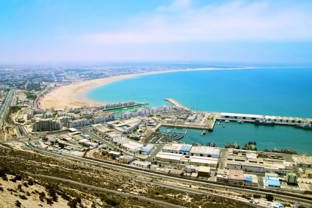 Panoramic view of Agadir beach, marina, and Atlantic coastline in Morocco.